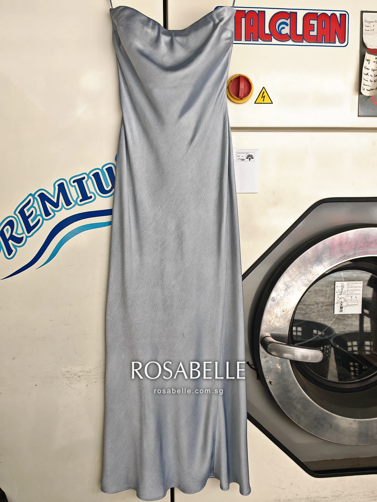 The same pale blue viscose maxi dress after cleaning, hanging full length with an even colour from neckline to hem