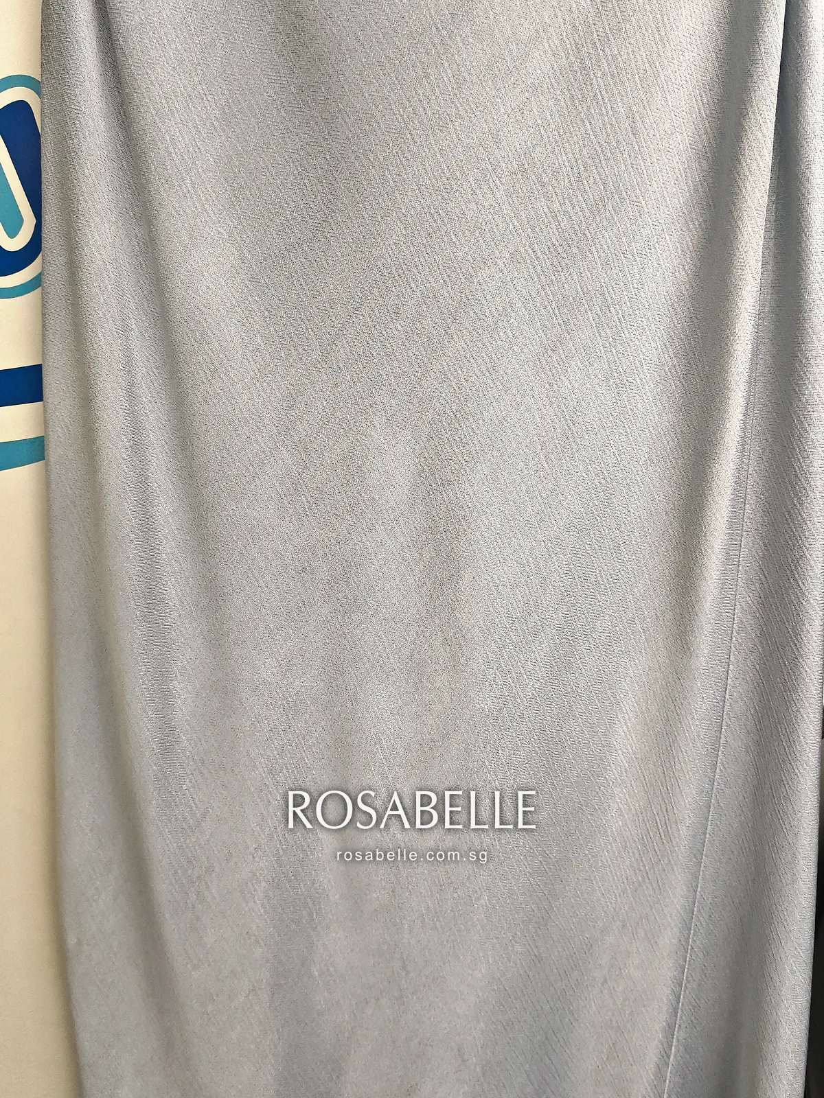 Skirt of the viscose dress after cleaning, an even pale blue with no brown marks