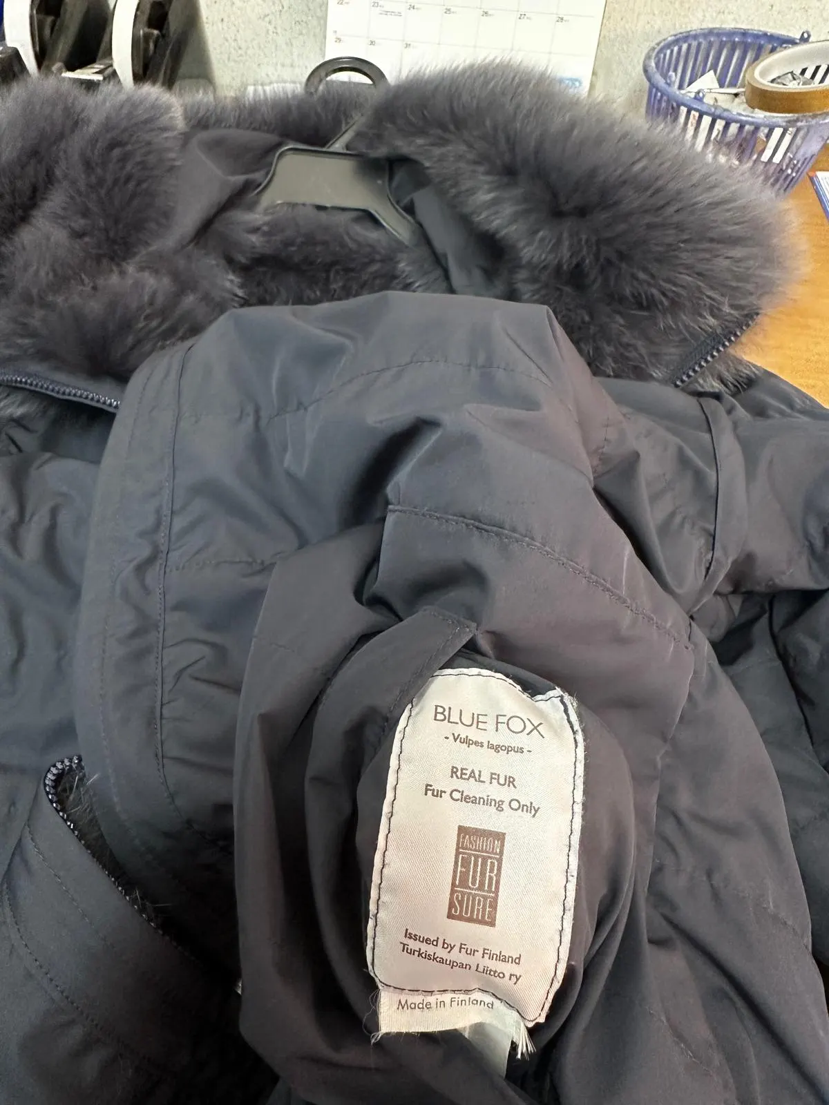 Care label reading Blue Fox, Vulpes lagopus, Real Fur, Fur Cleaning Only, issued by Fur Finland — made in Finland
