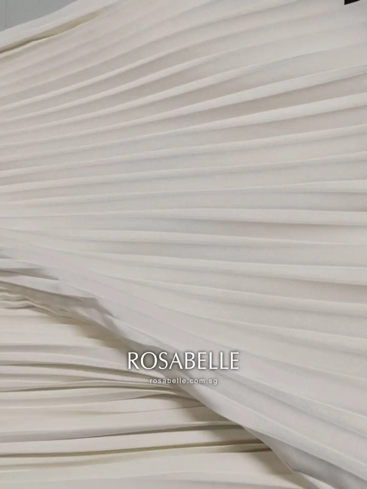 Close-up of the same pleats clean after treatment with the pleating intact