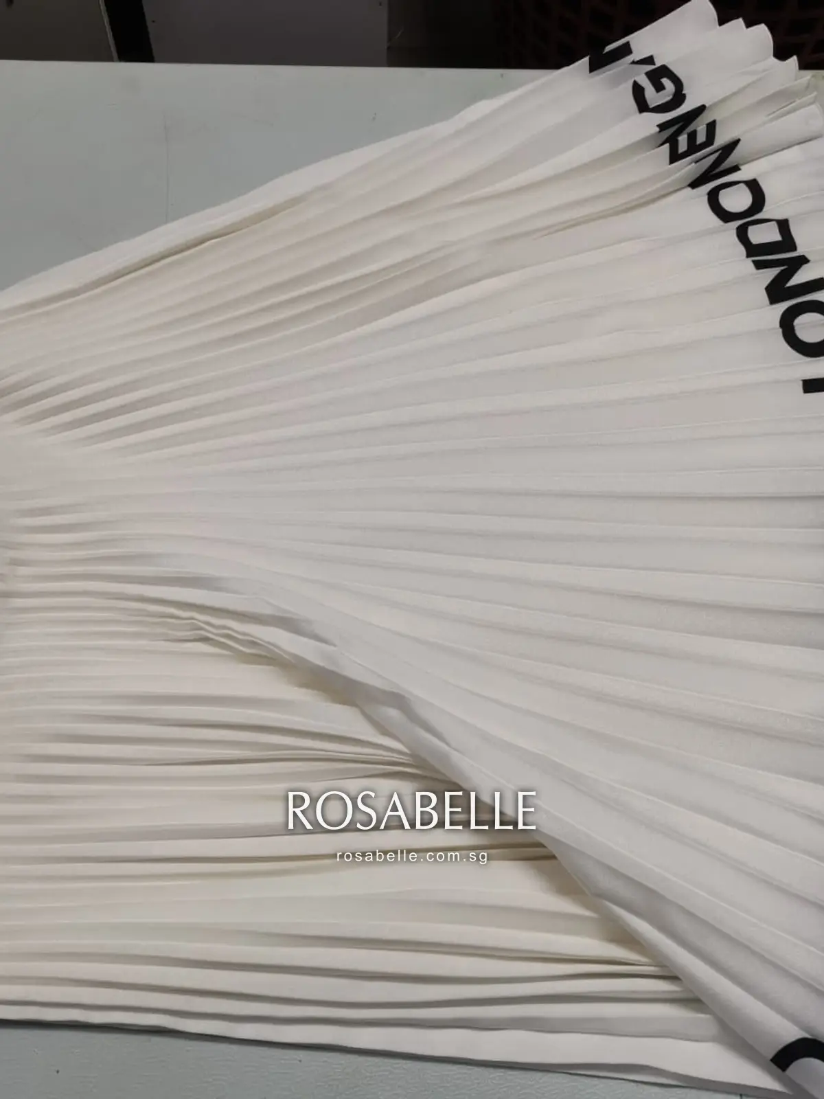 The same Burberry pleated skirt clean with the pleats intact after cleaning