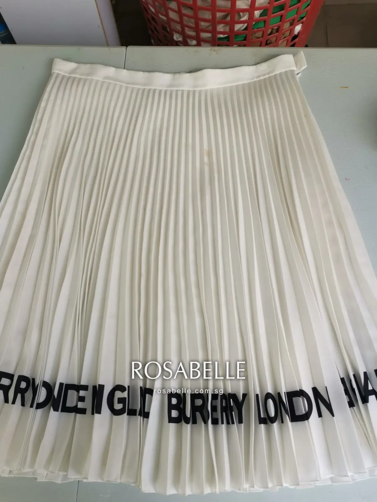 Cream Burberry pleated skirt before cleaning