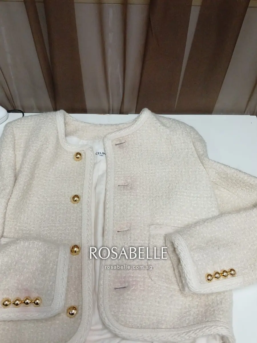 Cream Celine boucle jacket showing pink colour run before treatment