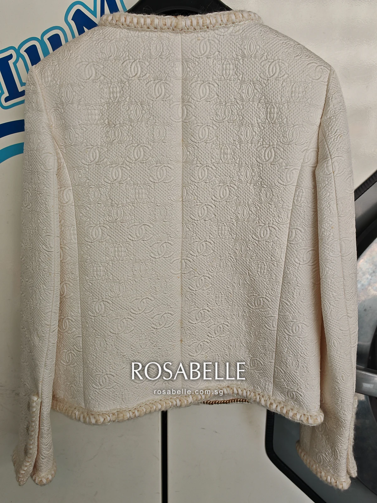 Back of the same jacket after cleaning, the seams straight and the shoulders holding their shape