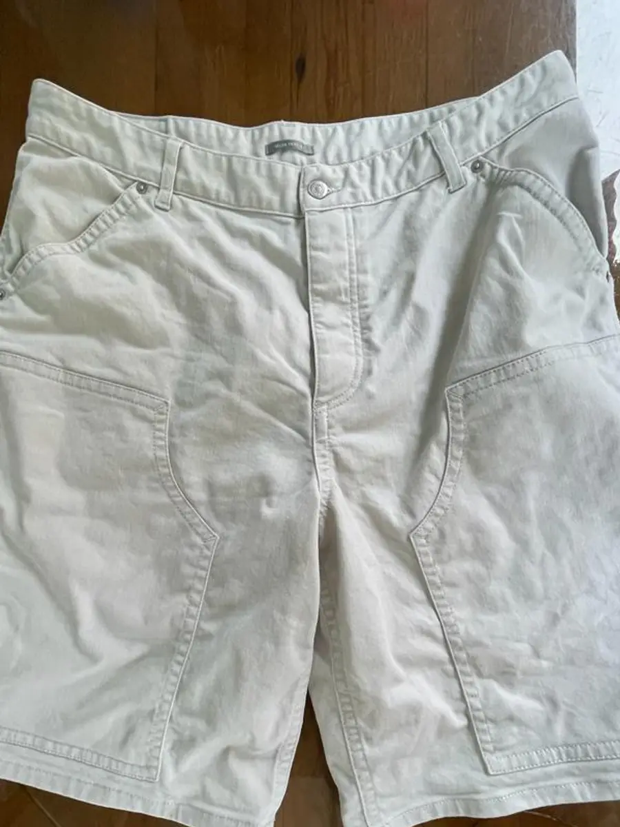 The same Christian Dior Bermuda shorts with the cream colour evened out and residual staining removed after restoration at Rosabelle Launderette Singapore