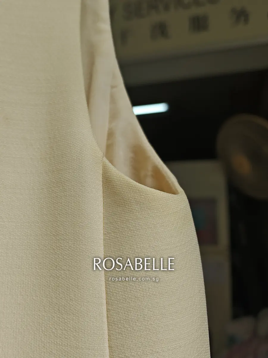 Armhole of the Dior dress after cleaning, the cream wool and silk even up to the silk-lined edge