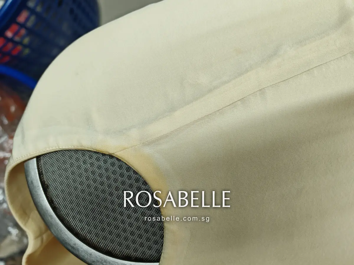 Second armhole of the cream Dior dress before cleaning, a yellow-brown perspiration ring along the lined edge