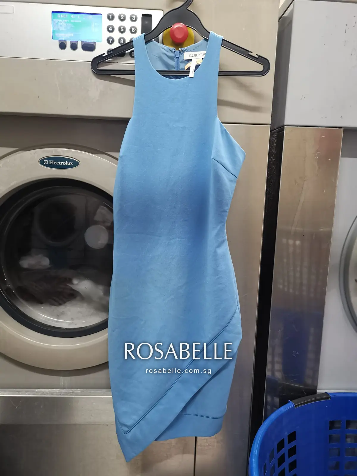 The same dress hanging clean after stain removal and a full clean at Rosabelle Launderette