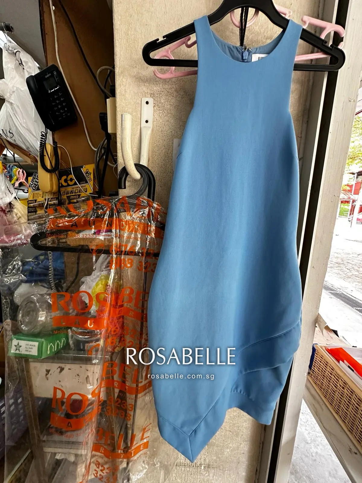 The same pale blue dress after yellowing was removed at Rosabelle Launderette Singapore