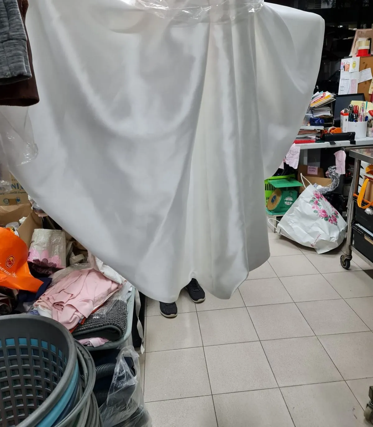 The same wedding gown fully restored to white after professional gown cleaning at Rosabelle Launderette Singapore