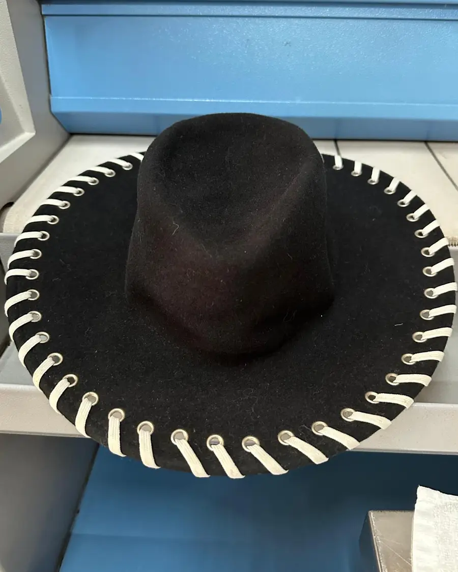Black wool felt wide-brimmed hat with cream whipstitched edging, in for hand cleaning at Rosabelle Launderette Singapore