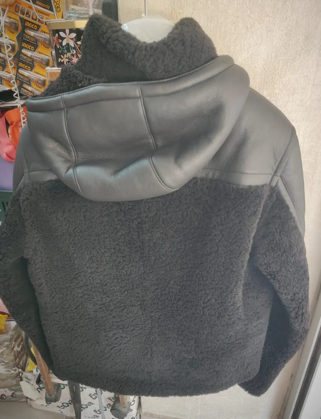 Back of the Hermès shearling jacket showing the wool face of the double-faced lambskin construction