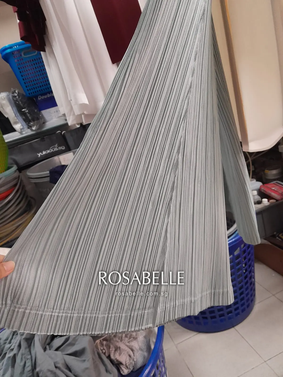 Close-up of the same pleating clean and fully set after cleaning