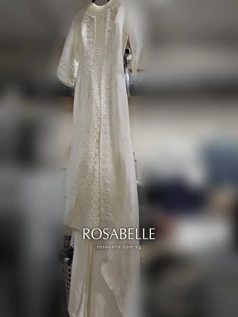 Full length of the fifty-year-old gown, three-quarter sleeves and floor-length skirt