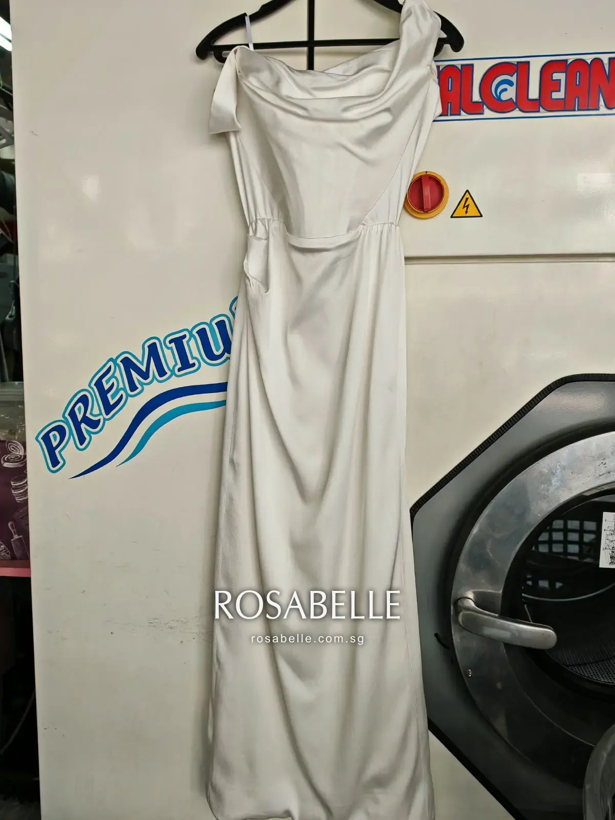 The same gown after cleaning, an even ivory across the whole garment