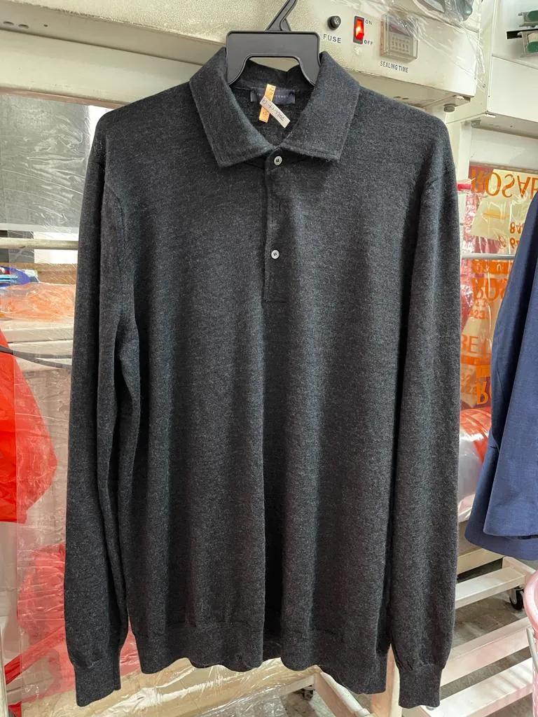The same wool knit polo restored smooth and back to shape after professional treatment at Rosabelle Launderette Singapore