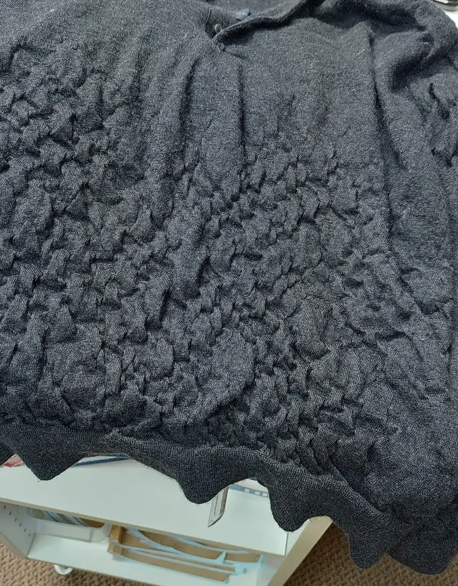 Wool sweater with felted puckered texture after home wash shrinkage — Rosabelle Launderette case study