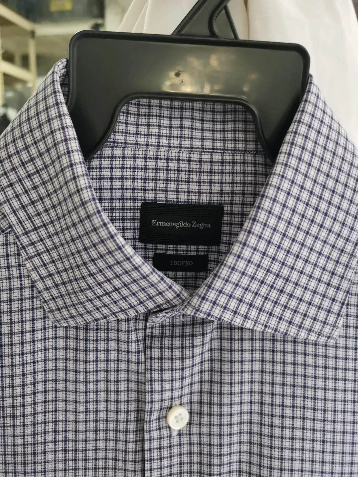 Inner collar labels reading Ermenegildo Zegna and Trofeo on the navy-check cotton shirt at Rosabelle Launderette Singapore