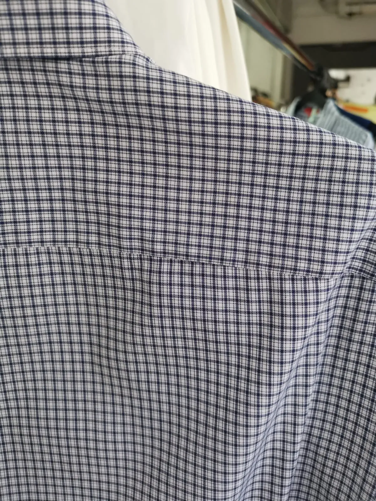Close-up of the same back yoke area clean after stain removal at Rosabelle Launderette