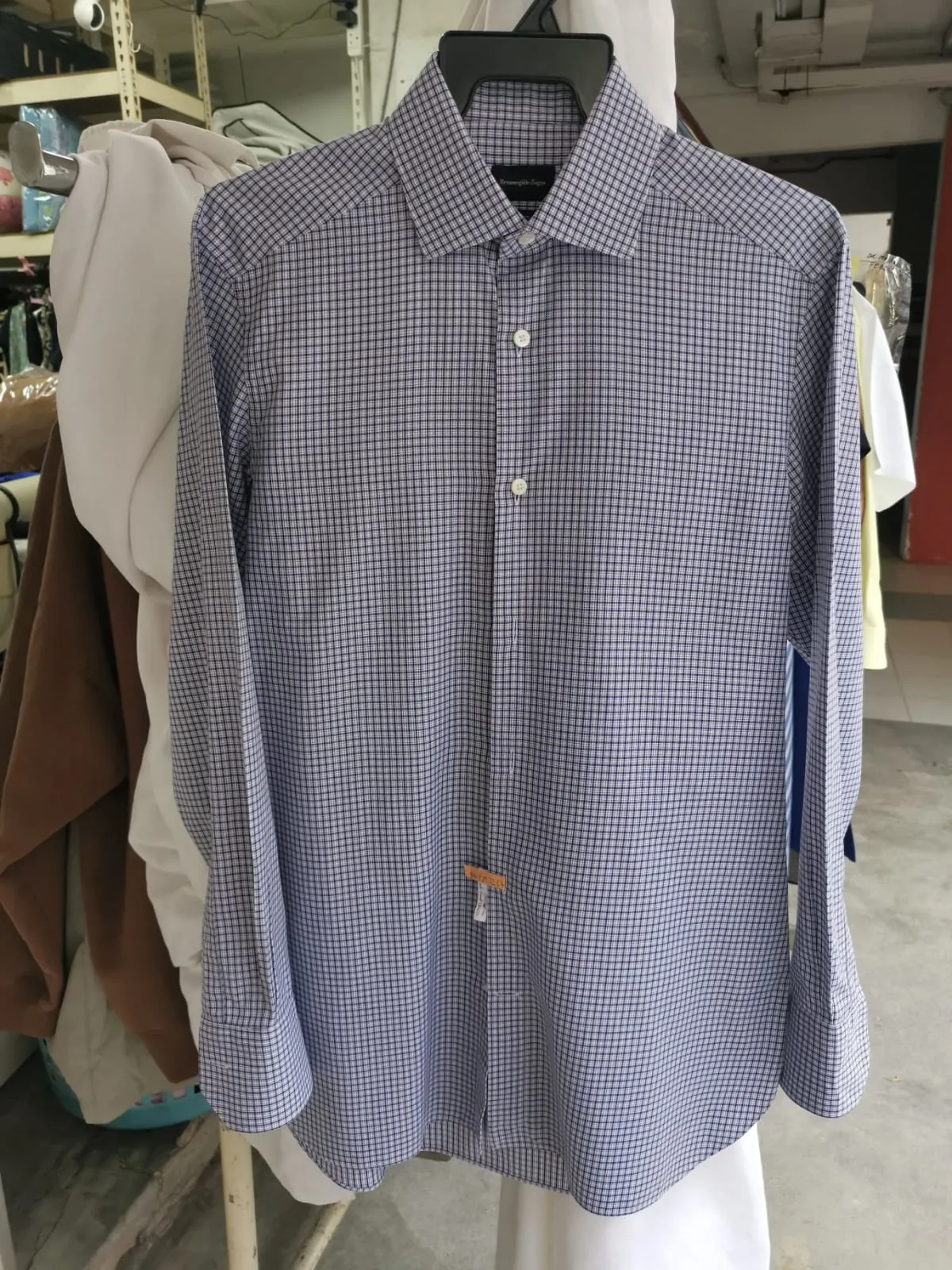 The same Zegna Trofeo shirt with stains fully removed after treatment at Rosabelle Launderette Singapore